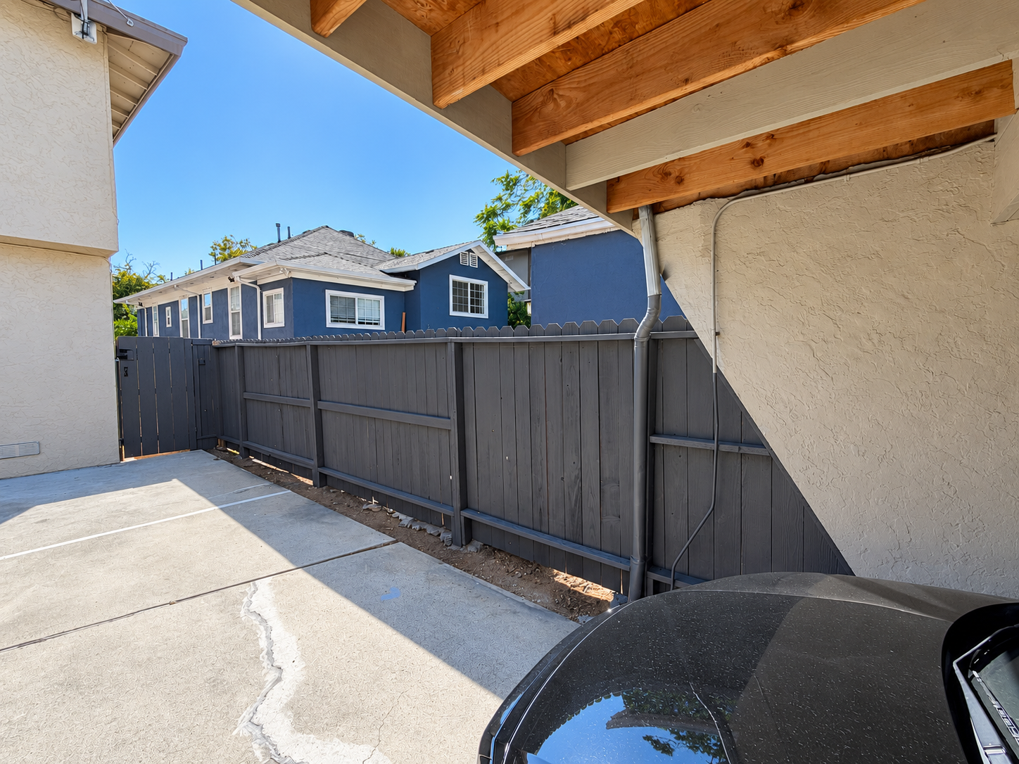Completed dark exterior fence painting project